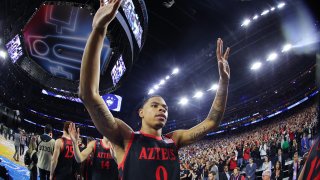 HOUSTON, TEXAS – APRIL 03: Keshad Johnson #0 of the San Diego State Aztecs waves goodbye to the fans at the end of the game in the NCAA Men’s Basketball Tournament National Championship game at NRG Stadium on April 03, 2023 in Houston, Texas. (Photo by C. Morgan Engel/NCAA Photos via Getty Images)
