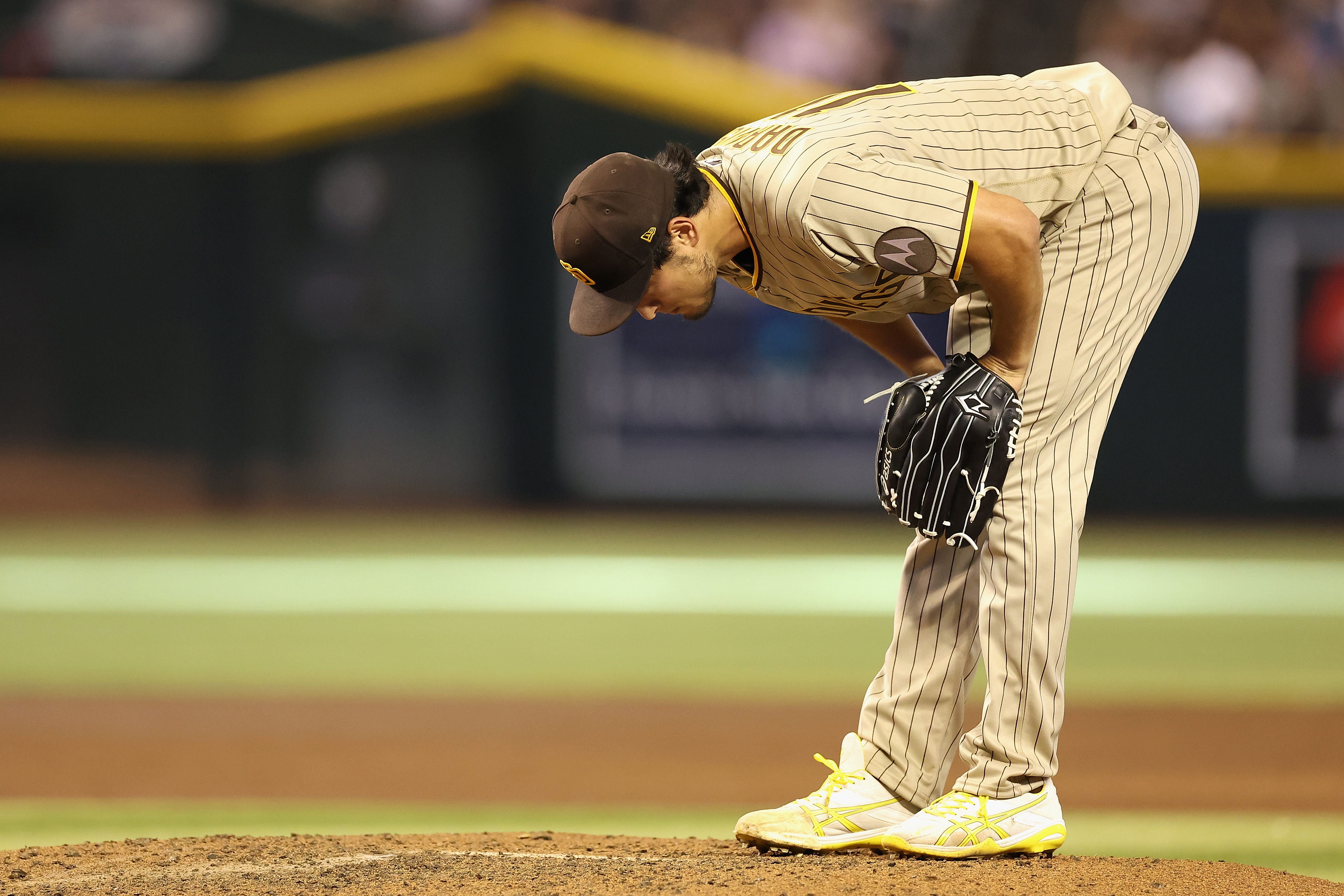 San Diego Padres manager Bob Melvin walks off the field during the News  Photo - Getty Images