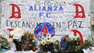 A memorial set up as a tribute to the soccer fans killed in the recent Cuscatlan stadium stampede, stands outside the stadium in San Salvador, El Salvador, Monday, May 22, 2023.