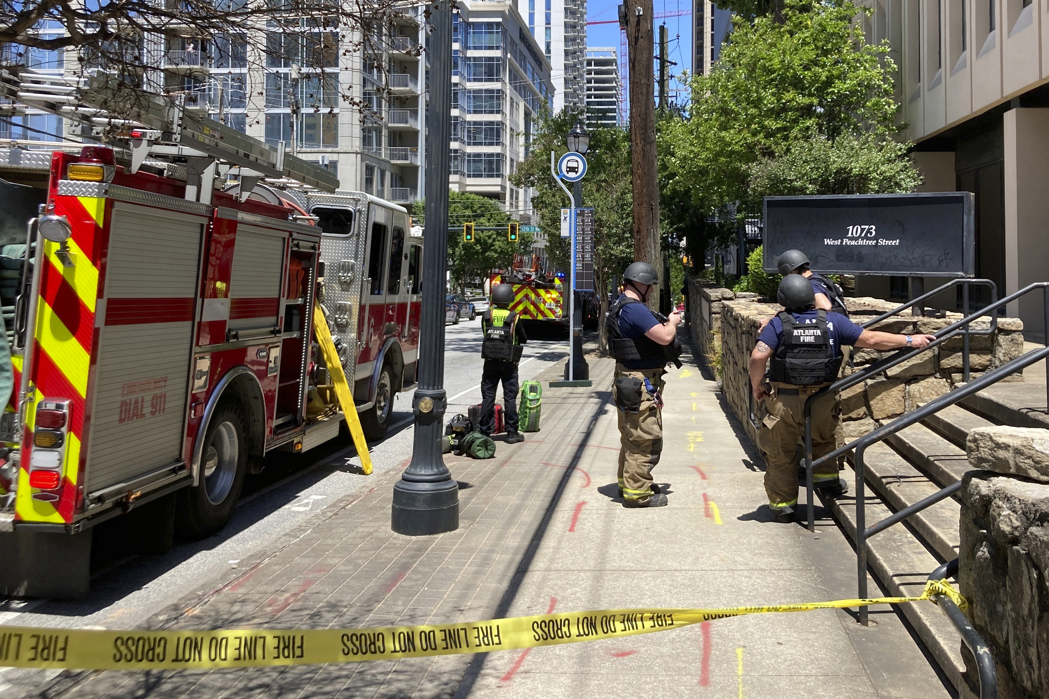 Emergency personnel respond to the scene of active shooting in Atlanta, May 3, 2023. At least one person died, with three others injured, during a shooting in midtown Atlanta.