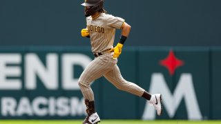 Fernando Tatis Jr. #23 of the San Diego Padres hits a solo home