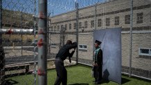 Incarcerated graduate Jose Catalan poses for photos after his graduation ceremony at Folsom State Prison in Folsom, Calif., Thursday, May 25, 2023.