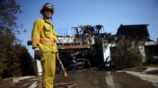 Santa Ana Winds Stoke Wildfires In Southern California