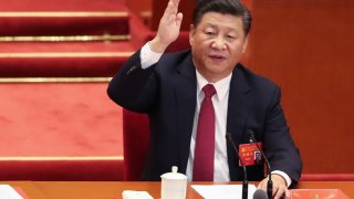 Chinese President Xi Jinping vote at the closing of the 19th Communist Party Congress at the Great Hall of the People on October 24, 2017 in Beijing, China.