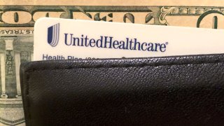 A UnitedHealth Group health insurance card is seen in a wallet, Oct.14, 2019.