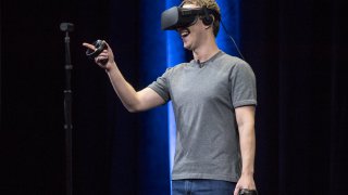 Meta CEO Mark Zuckerberg demonstrates an Oculus Rift virtual reality (VR) headset and Oculus Touch controllers during the Oculus Connect 3 event in San Jose, California, U.S., on Thursday, Oct. 6, 2016.