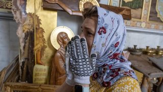 ODESA, UKRAINE – JULY 23: Orthodox believer Olha Golubova reacts with emotion as Ukrainians clear away debris after a Russian missile struck the historic Holy Transfiguration Cathedral in central Odesa.