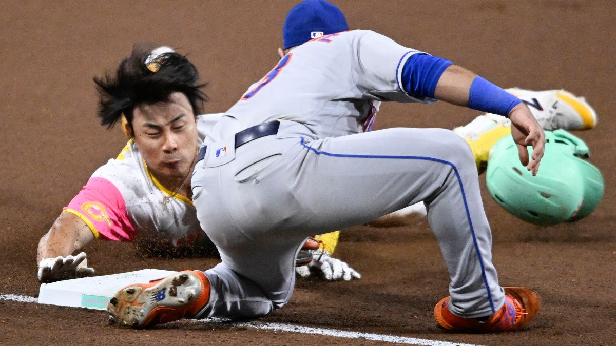 New York Mets third baseman Luis Guillorme, left, tags out San Diego  Padres' Ha-Seong Kim, trying to reach third off a double during the seventh  inning of a baseball game Friday, July