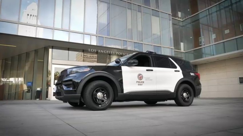 An LAPD SUV in front of a building.