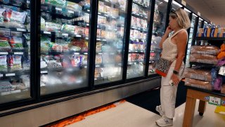 A shopper makes their way through a grocery store on July 12, 2023 in Miami, Florida.