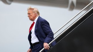 Former president Donald Trump arrives at Ronald Reagan Washington National Airport in Arlington, Va. on Thursday, August 3, 2023 after appearing at E. Barrett Prettyman United States Court House. 