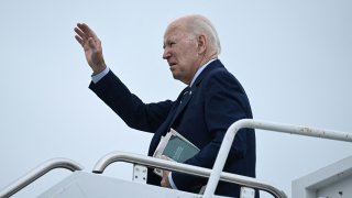 U.S. President Joe Biden waves as he departs from Delaware Air National Guard Base in New Castle, Delaware, en route to Joint Base Andrews, Aug. 7, 2023.