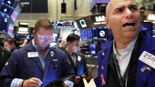 Traders work on the floor of the New York Stock Exchange, Aug. 15, 2023.