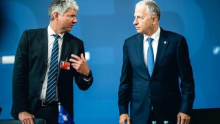 Stian Jenssen (left), Director of the Private Office of the NATO Secretary General, talks to the NATO Deputy Secretary General, Mircea Geoana during the informal meeting of NATO Ministers of foreign affairs on May 15, 2022 in Berlin, Germany.