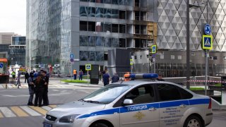 Police car seen near a damaged building at the sight of another drone attack on Moscow. On July 30, Ukraine attacked the Russian capital with drones.