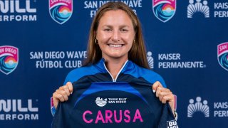 Kyra Carusa signs a contract with the San Diego Wave Fútbol Club on August 16, 2023 in Del Mar, California at Wave FC Headquarters.