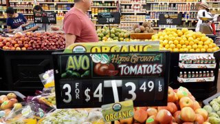 People shop in the produce section of a grocery store on September 12, 2023 in Los Angeles, California.