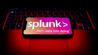 Splunk logo displayed on a phone screen and a laptop keyboard are seen in this illustration photo taken in Krakow, Poland on October 30, 2021. (Photo by Jakub Porzycki/NurPhoto via Getty Images)