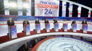 Republican presidential candidates stand on stage before a Republican presidential primary debate hosted by FOX News Channel on Aug. 23, 2023, in Milwaukee.