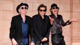 Keith Richards, from left, Ronnie Wood, and Mick Jagger pose for photographers