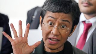 Filipino journalist Maria Ressa, 2021 Nobel Peace Prize winner and Rappler CEO, gestures as she talks to reporters after being acquitted by the Pasig Regional Trial Court over a tax evasion case in Pasig city, Philippines.