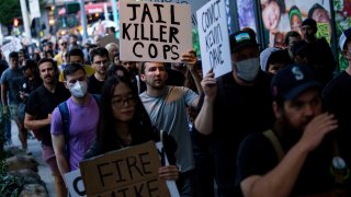 Protesters march through downtown Seattle