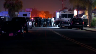 An officer from San Diego Police Department's sniper unit shot the suspect, who was at the time armed with a rifle when he was shot, according to the San Diego County Sheriff's Department.
