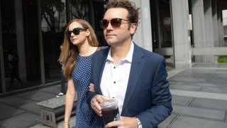 FILE - Actor Danny Masterson arrives at Clara Shortridge Foltz Criminal Justice Center in Los Angeles, CA on Wednesday, May 31, 2023 with wife Bijou Phillips
