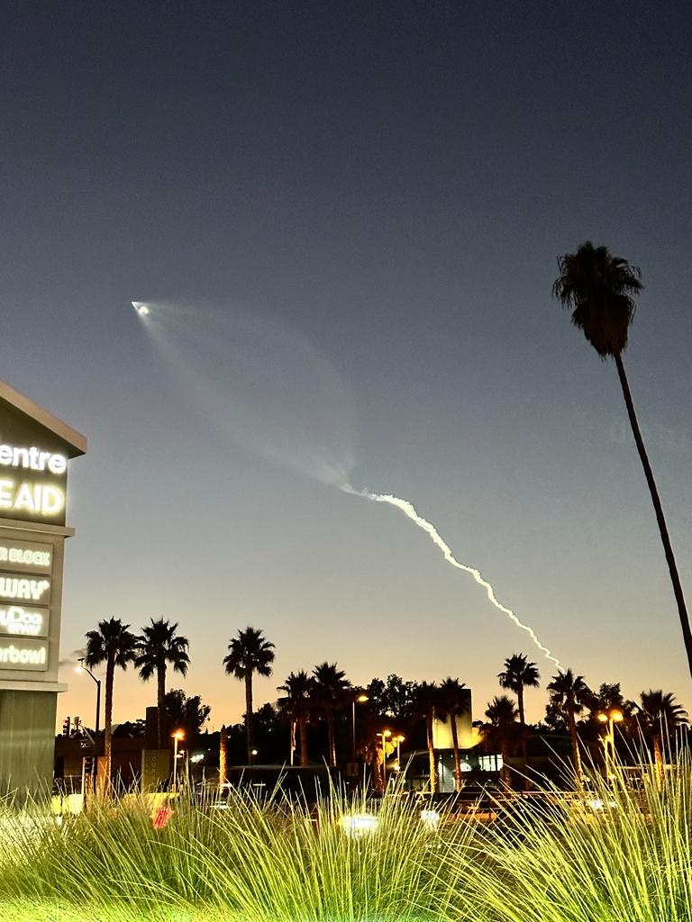 A rocket streaks across the sky