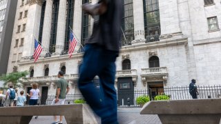 People walk outside of the New York Stock Exchange (NYSE) on September 05, 2023 in New York City.