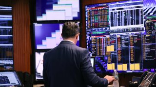 Traders work on the floor of the New York Stock Exchange during morning trading on Oct. 4, 2023.