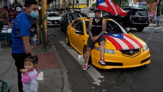 After almost a year and a half of cancelled gatherings and parades due to the COVID-19 pandemic, street life returns to normal at the Brooklyn Puerto Rico Day Parade on June 13, 2021 on Knickerbocker Avenue in the Bushwick neighborhood of Brooklyn, New York.