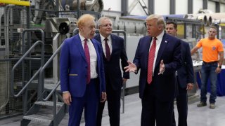 FILE - Businessman Anthony Pratt, Prime Minister Scott Morrison and President Donald Trump at the opening of Pratt Industries Wapakoneta recycling and paper plant in Wapakoneta, Ohio, on Sept. 22 2019.