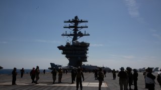 File. crew are seen on the flight deck of the USS Nimitz (CVN-68) during an South Korea and US combined maritime exercise as a part of Warrior Shield at sea on March 27, 2023 off the coast of South Korea. The USS Aircraft Carrier Nimitz (CVN-68) will be based in South Korea for the combined maritime exercise amid heightened tensions caused by North Korea’s missile tests and hardening rhetoric against the allies. North Korea fired a ballistic missile toward the East Sea on Monday, Seoul’s military said.