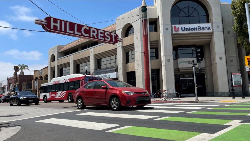 The neighborhood sign at the heart of Hillcrest at the intersection of 5th and University avenues.