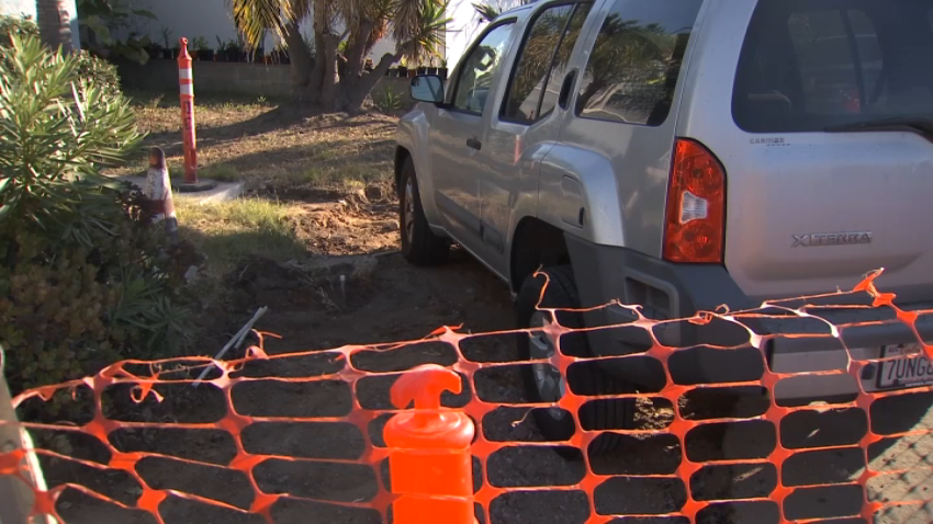 A South Park homeowner parks over a city of San Diego construction zone to protest the construction outside his home. Oct. 18, 2023.