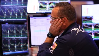 Traders work on the floor of the New York Stock Exchange during afternoon trading in New York City on Sept. 26, 2023.