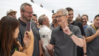 Tim Cook, chief executive officer of Apple Inc., holds an iPhone 15 Pro Max during an event at Apple Park campus in Cupertino, California, US, on Tuesday, Sept. 12, 2023. 