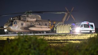 A helicopter with Israeli hostages released earlier by Hamas lands at Sheba Medical Centre on the sixth day of the temporary truce after Hamas blamed ‘technical issues’ on the delay as family and friends wait nearby in the early morning hours of November 30, 2023 in Ramat Gan, Israel.