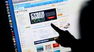 A consumer looks at Cyber Monday sales on her computer