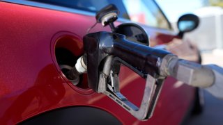 A motorist fills up the fuel tank of a vehicle, Nov. 17, 2023.