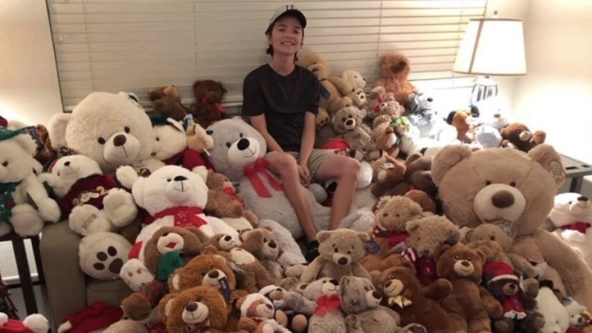 Caden Henderson, 18, poses with several teddy bears to donate to Loma Linda University Children’s Hospital.