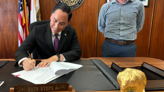 San Diego Mayor Todd Gloria signs into law two programs intended to make the city safer: the Smart Streetlights and Safe Sidewalks programs. (Office of Mayor Todd Gloria)