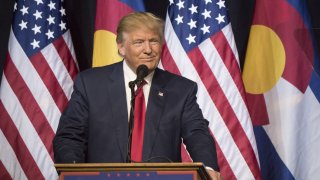 FILE - Donald Trump, 2016 Republican presidential nominee, smiles during a campaign event in Pueblo, Colorado, Oct. 3, 2016.