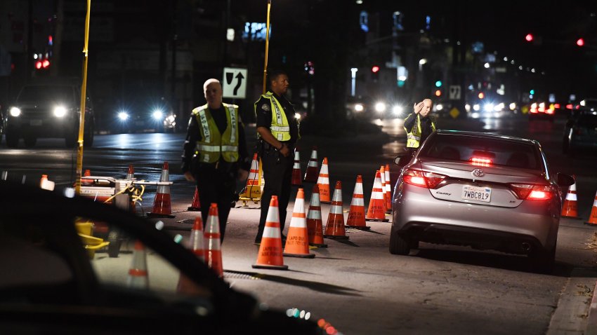LAPD police check drivers at a DUI checkpoint. Archive.