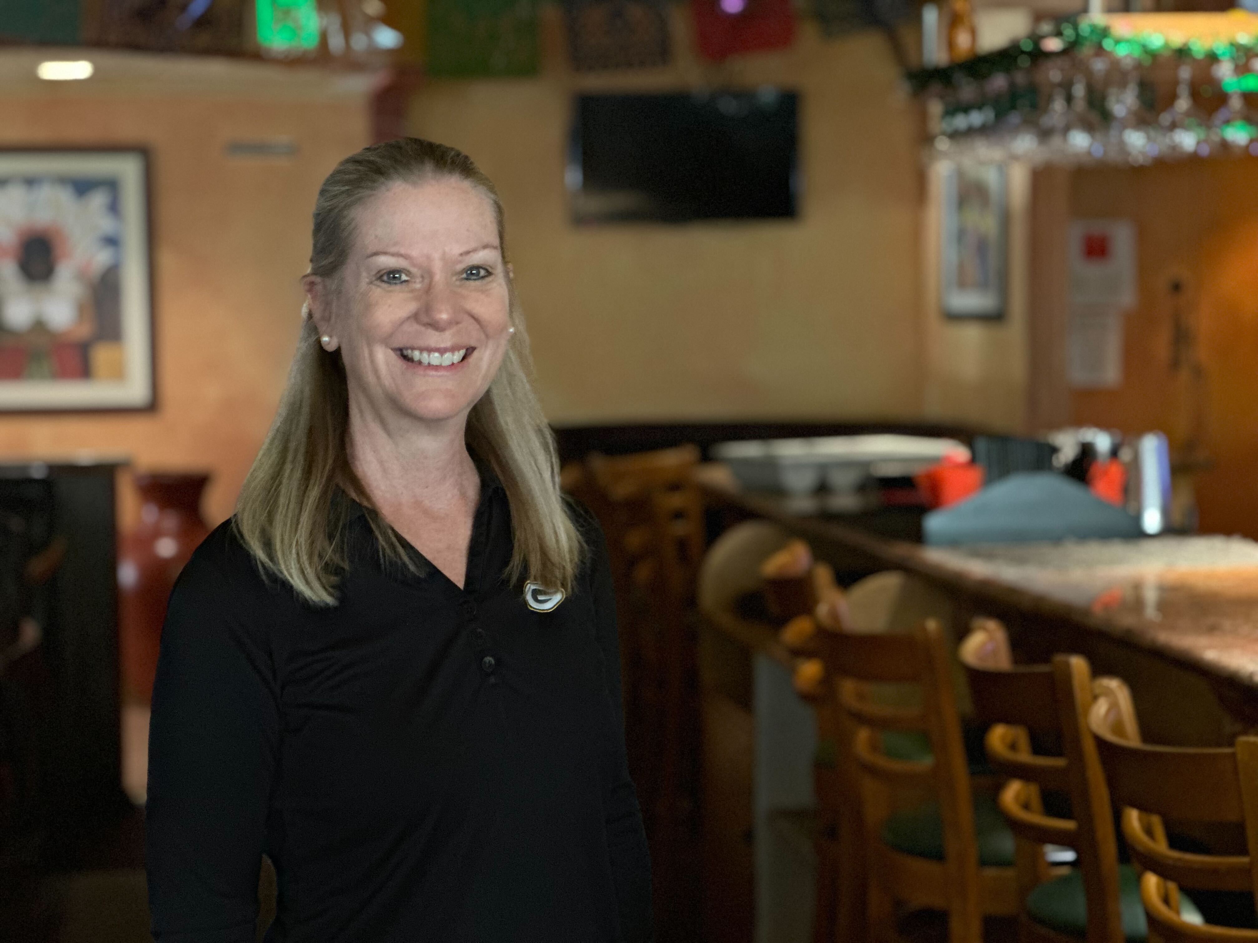 Tio Leo's General Manager Barbara Perez poses for a photo in the bar, Dec. 13, 2023.