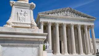 FILE - The U.S. Supreme Court is seen, with a carving of Justice in the foreground, April 19, 2023, in Washington.