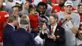 Kansas City Chiefs owner and CEO Clark Hunt raises the Vince Lombardi Trophy after they defeated the San Francisco 49ers 31-20 in Super Bowl LIV at Hard Rock Stadium on February 02, 2020 in Miami, Florida.