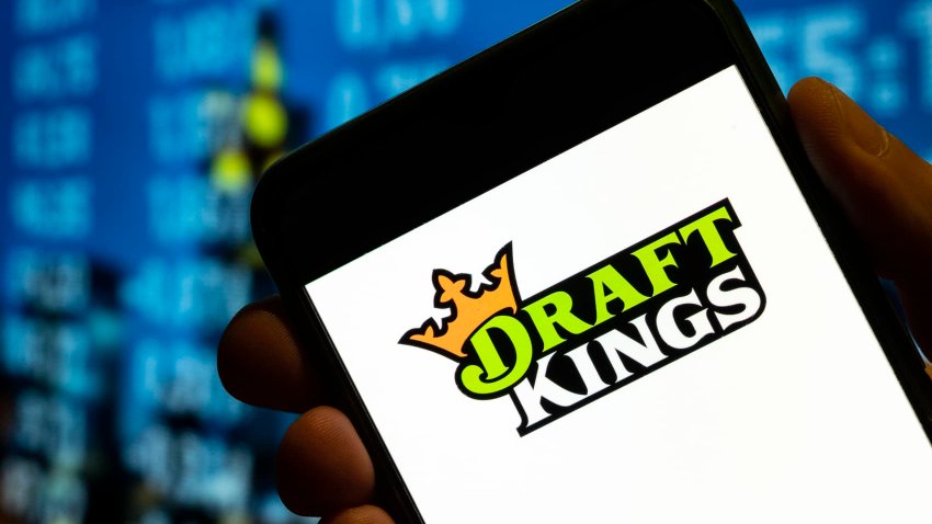 Sports betting company DraftKings’ logo is displayed on a smartphone screen.