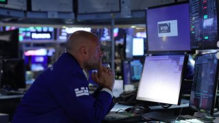 Traders work on the floor of the New York Stock Exchange on Aug. 2, 2023.